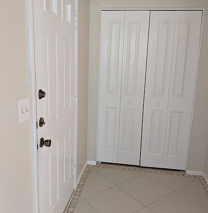 Entrance with storage closet
