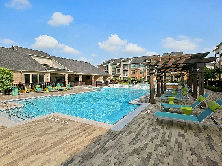Enjoy sunny days by the shimmering pool at Cityscape Apartments in Houston, Texas.