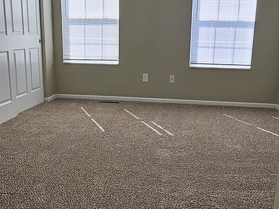 Master Bedroom looks out over patio. Amazing CLOSET. New carpet