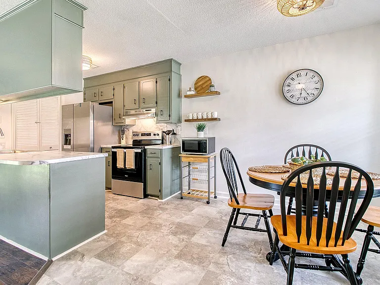 A convenient dining area near the kitchen improves the functionality of your living space.