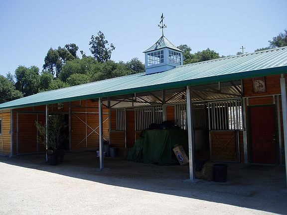 New barn with 2 horse stalls and a bedroom with 3/4's bath.