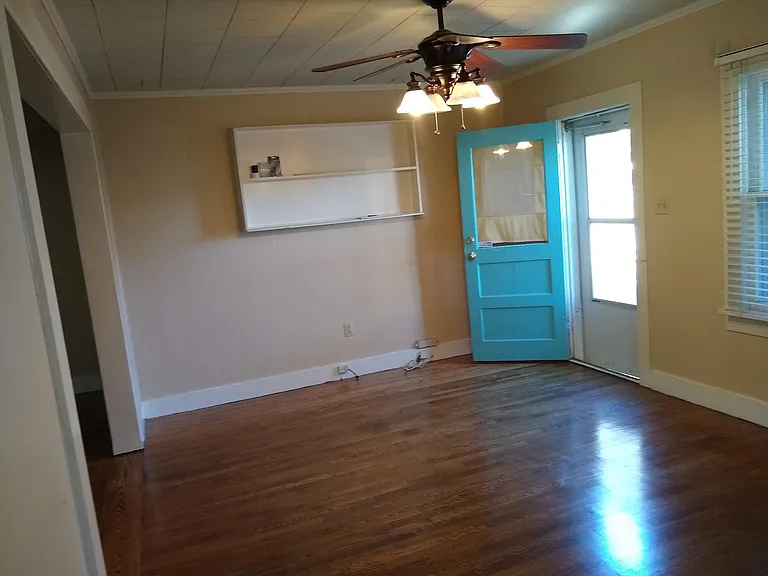 Living room looking toward front door/ shelves