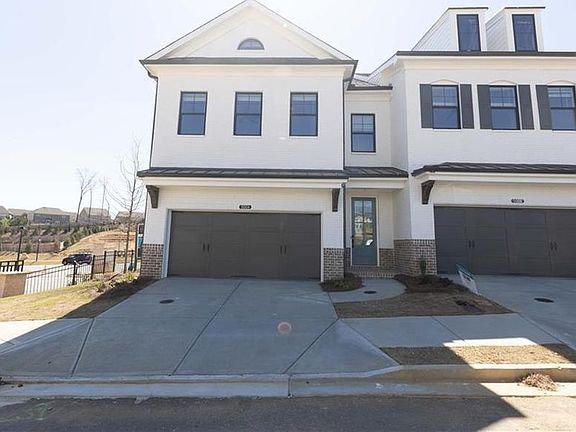 End Unit -- Stockton plan. Photo of a previously built home and Not of Actual Home