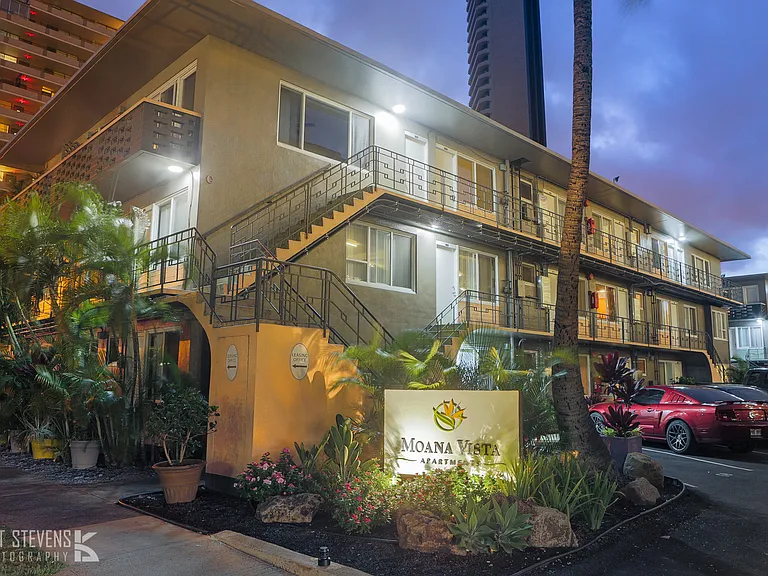Moana Vista Apartments exterior building and signage at night