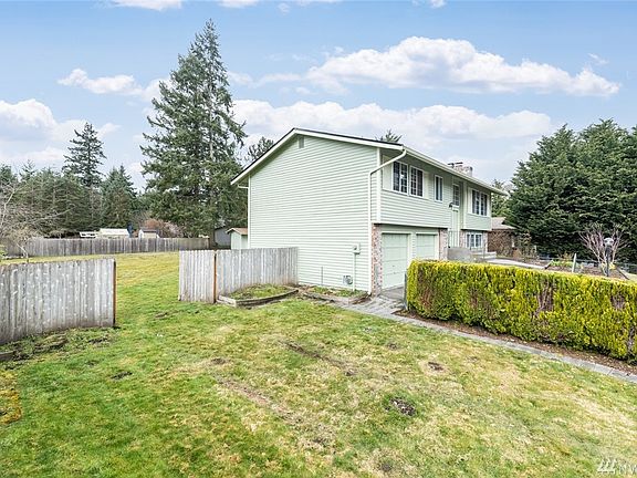 The wooden fence also has double-wide gates for easy access to the back yard.