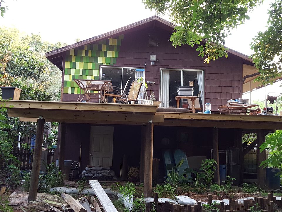 home is being painted various colors of green