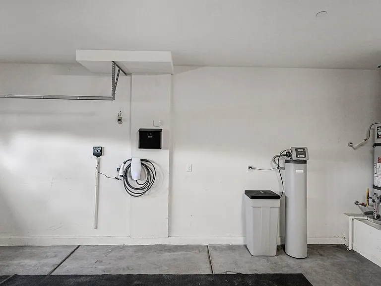 EV charger for Tesla and Non-Tesla vehicles (J-1772 adapter available). Water softening system.