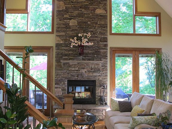 Dynamic vaulted ceilings with a huge stone wood burning fireplace.