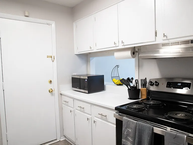 Kitchen
Additional way to enter/exit apartment to get to the pool and mailbox