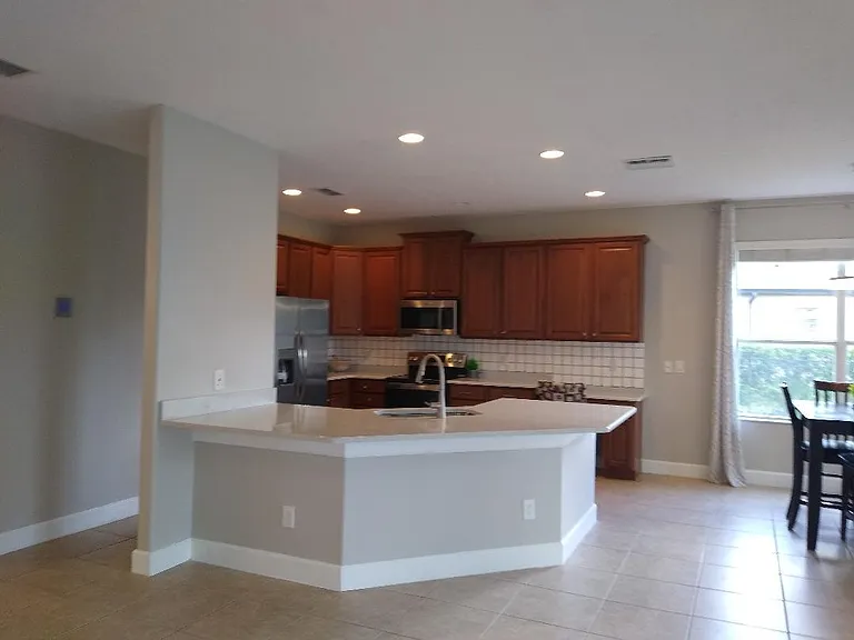 Kitchen with recently new Fridge, Oven, Microwave and quartz countertops