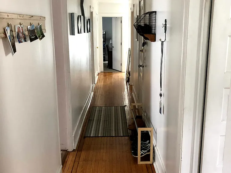 Hallway connecting bedrooms, bathrooms and main living area
