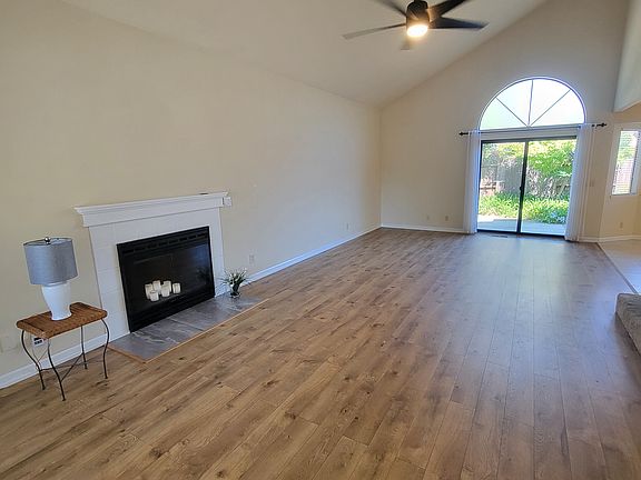 Large Livingroom with Ceiling Fan/light, fireplace, coat closet, digital thermostat, 
6" sliding glass door, cable ready.