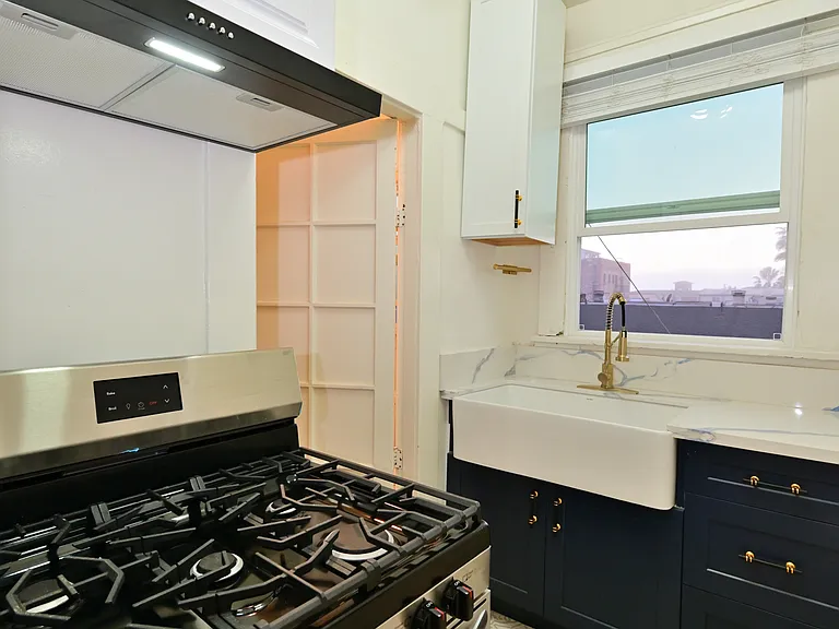 fully upgraded kitchen with microwave, SS gas range and vent hood
