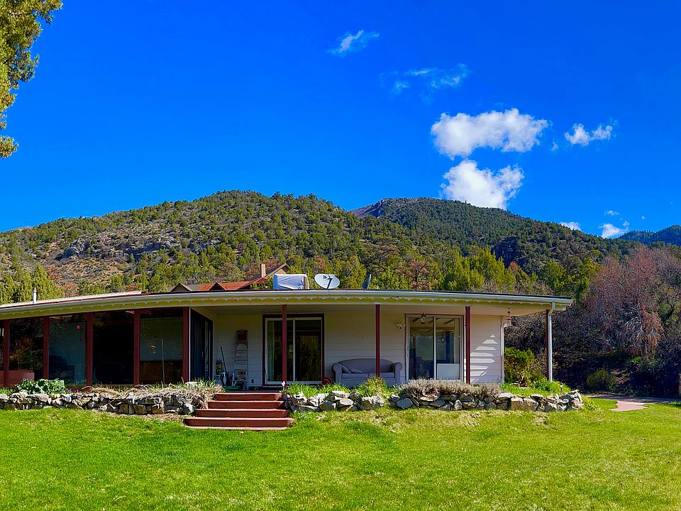 View of yard and home looking east towards the local Table Top Mountains.