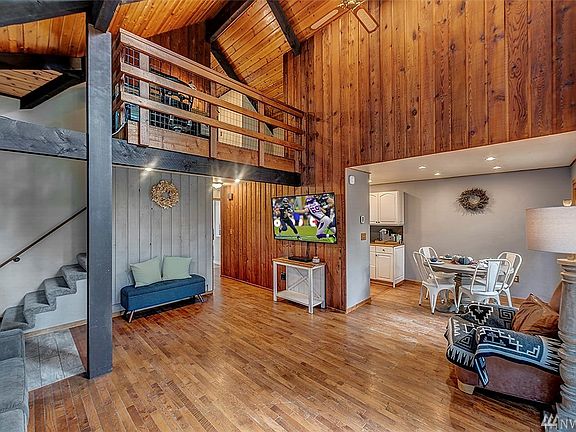 You'll love the vaulted ceiling in this light filled living and dining room.