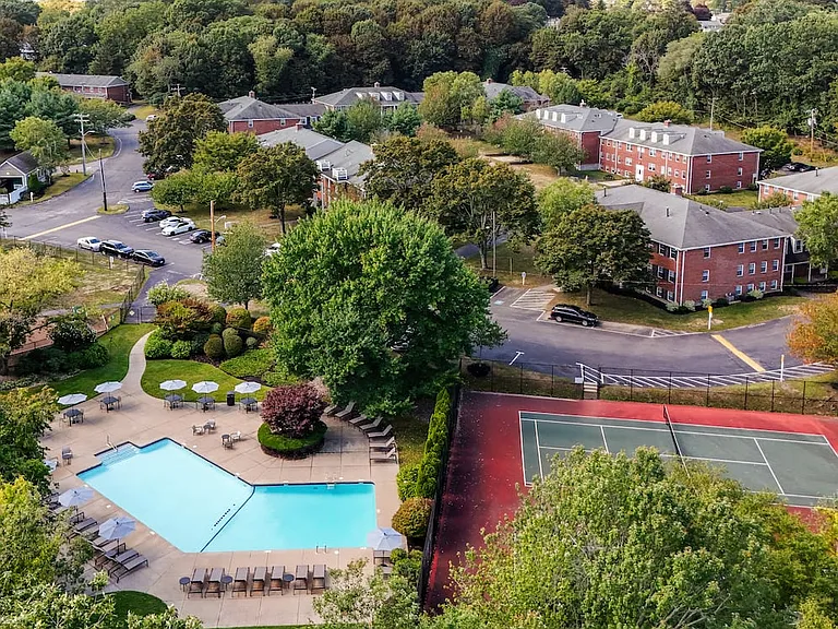 Swimming pool, tennis court, and building exterior