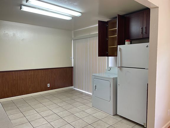 Washer dryer in kitchen.