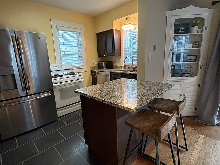 Kitchen with raised breakfast bar area