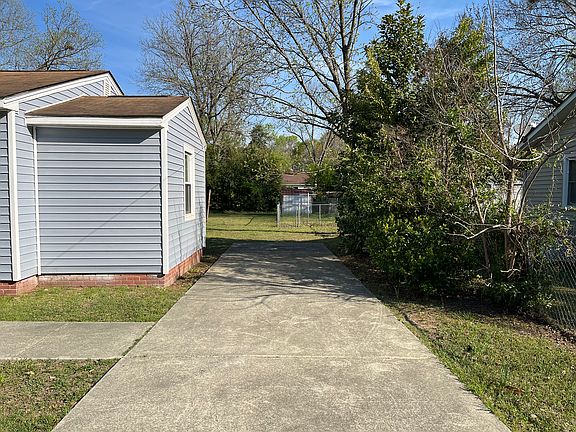 Private driveway that fits two cars/trucks comfortably; gate can be closed for extra security.