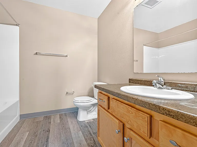 Stylishly designed and meticulously maintained, the bathroom at Minot Place Apartments features modern fixtures and elegant finishes, creating a perfect blend of comfort and functionality. Schedule your tour today to see it for yourself!
