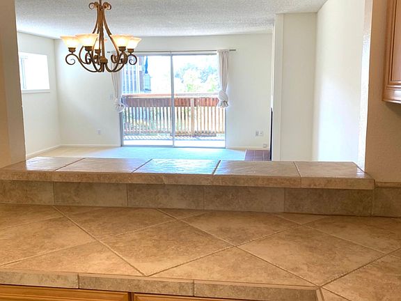 View from kitchen into living area and Mt. Tam
