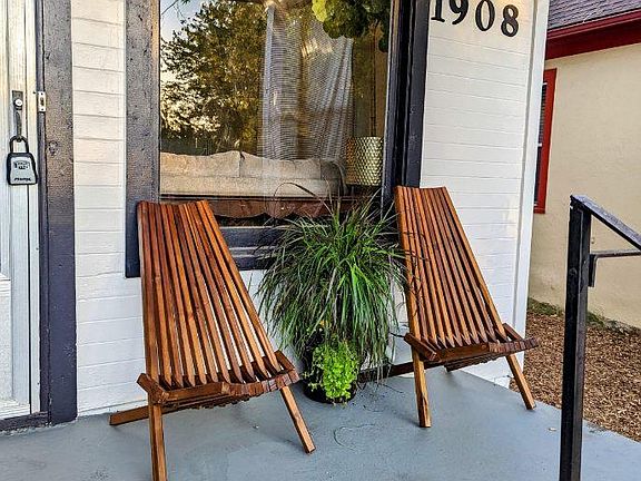 Front porch and entry. Private off street parking in back with back entry as well.