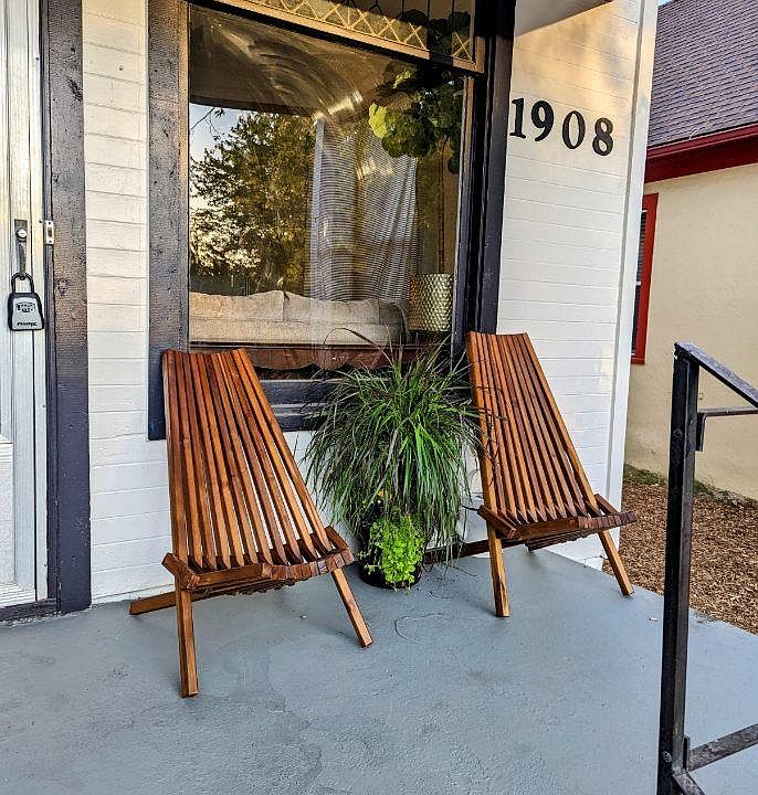 Front porch and entry. Private off street parking in back with back entry as well.