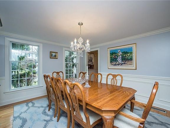 Natural light floods the home as seen here with the double windows facing the front of the property.  Access to the home's entry