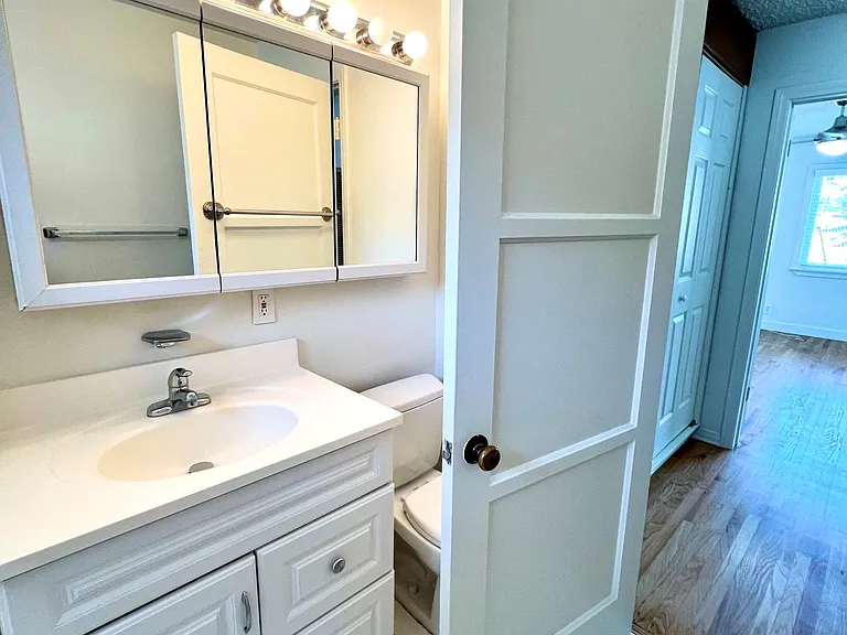 bright and light bathroom with tub and shower