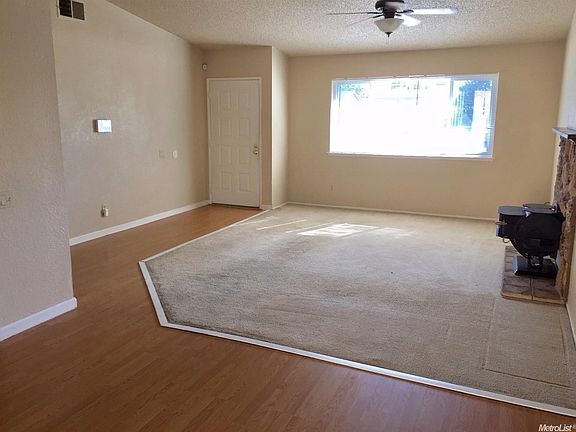 Open living room with cozy fireplace.