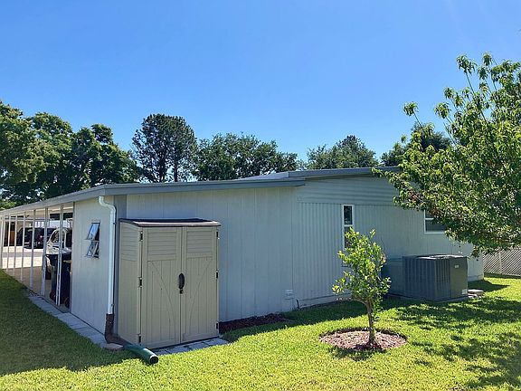 Rear view with storage shed