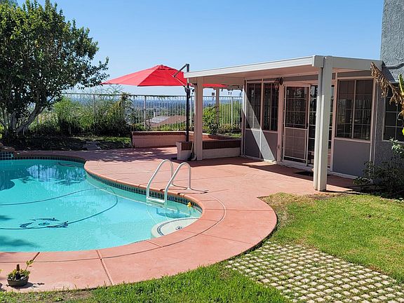 A huge backyard with a city lights view is great for entertainment and kids!