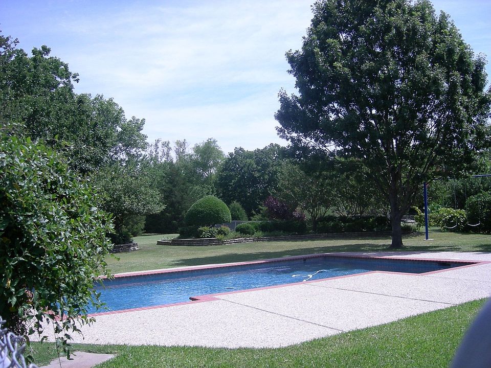 Huge yard with pool, deck, trees and privacy