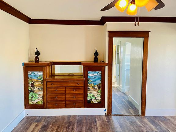 Beautiful antique stained glass doors on the built-in entertainment center/storage cabinets.