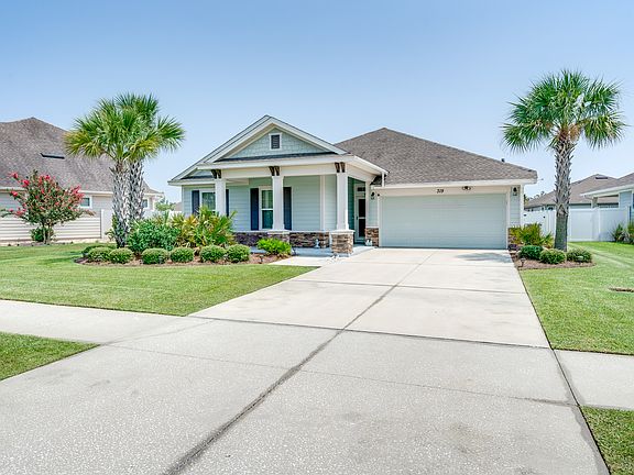 Large lot with a wide driveway offers extra privacy, space between neighbors, and convenience for multiple vehicles.