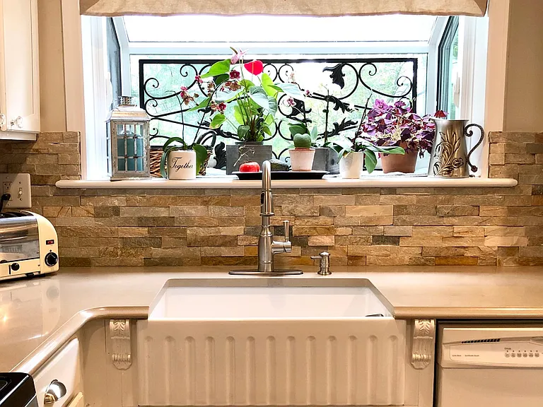 Large farm sink. Garbage disposal. Beautiful, new Garden Window with sides that open.