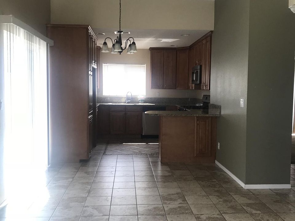 Kitchen open to the living area, newer cabinets, fixtures an