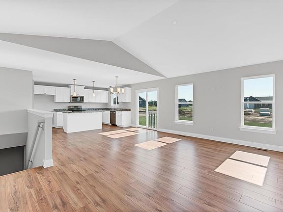 Vaulted Great Room with beautiful laminate flooring