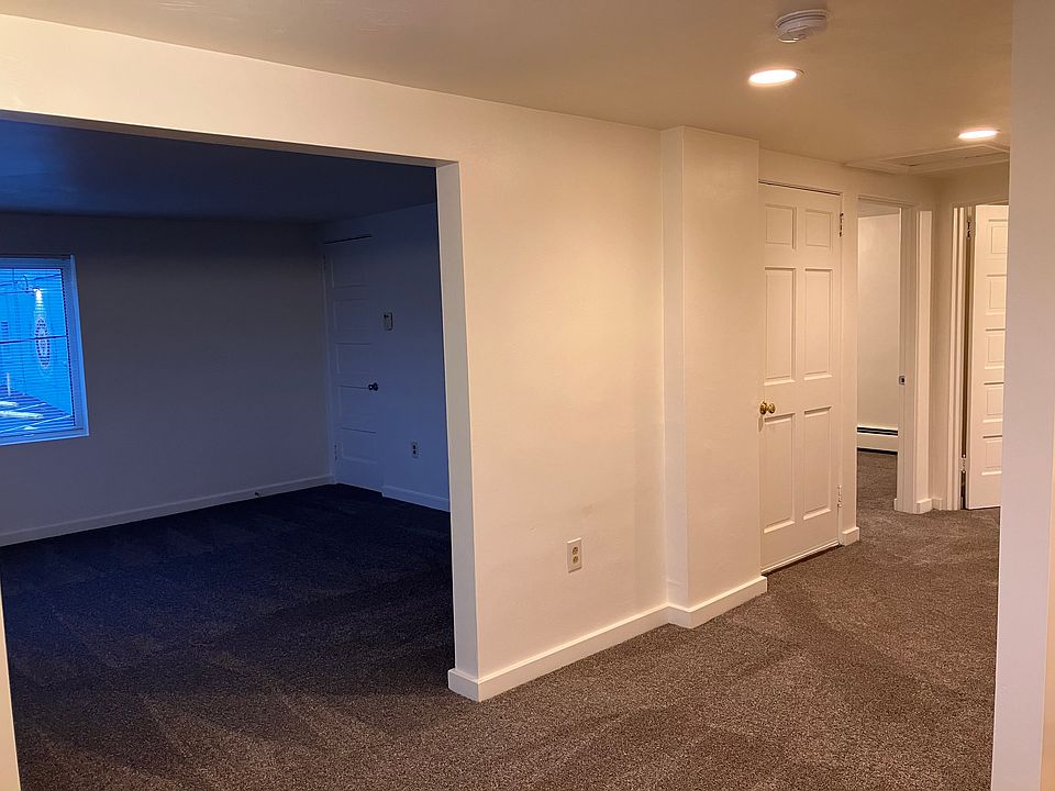 standing in dining room, looking to living room and hallway