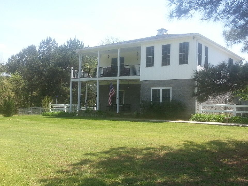 Beautiful front view showing
two large porches