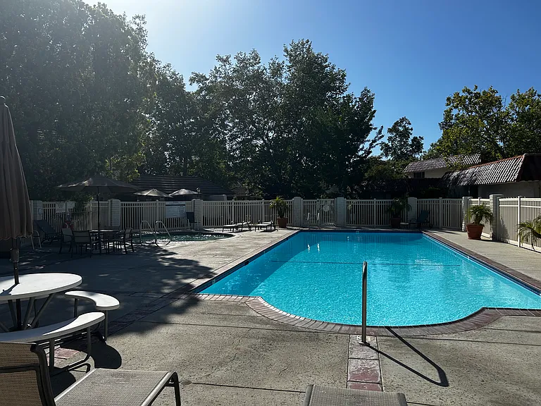 One of 2 community pools with hot tub