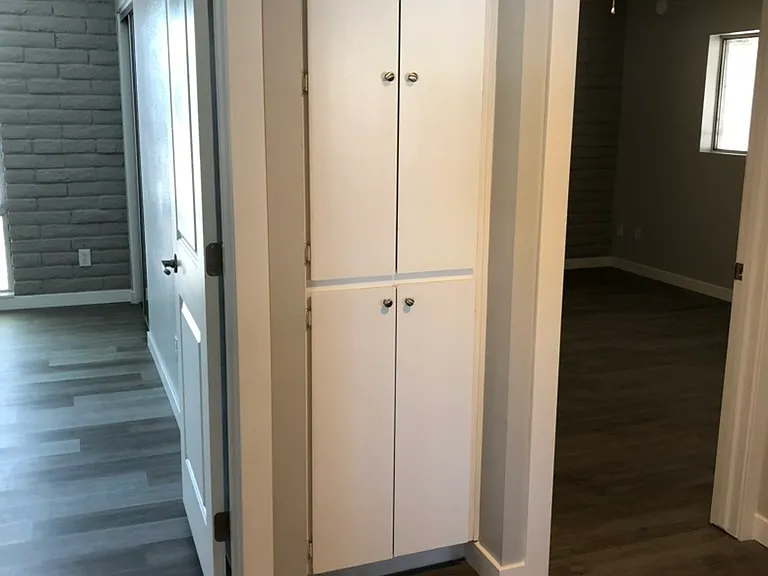 Hall way with linen closet between Master & bedroom 2