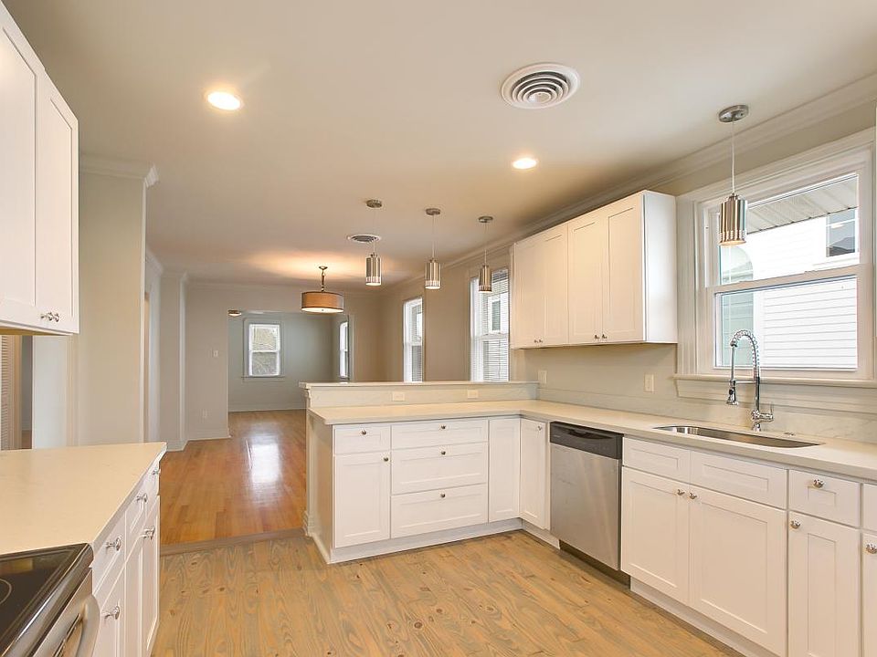 Large Kitchen, lots of cabinet space, completely updated with modern faucets, deep sink, lighting, cabinets and hardware.