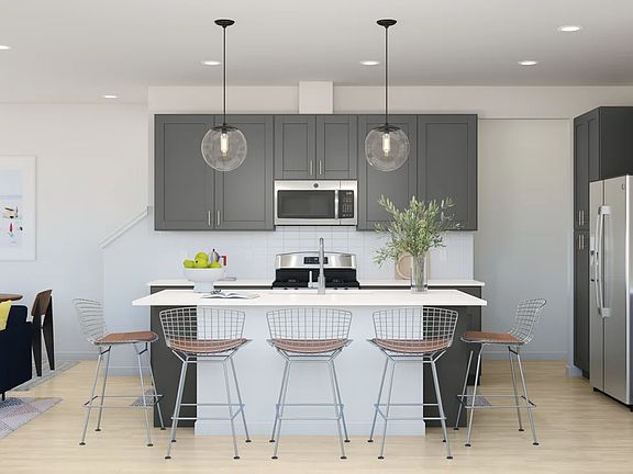 Kitchen with pendant lighting and floating shelves