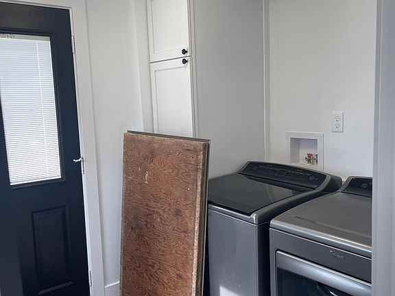 The mud room/laundry room has access to the crawl space where a new water heater and furnace are located.