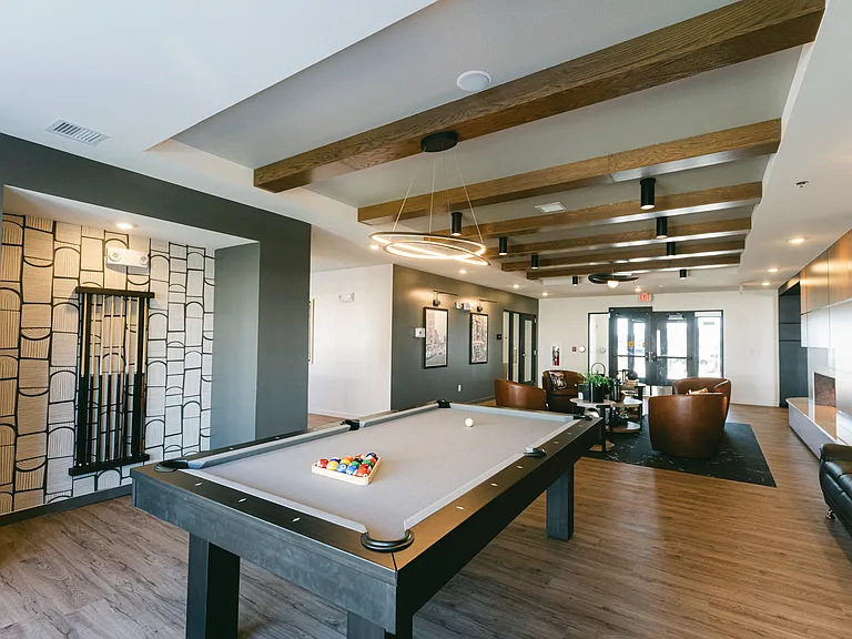 Unwind in style at The Earl Twin Homes, where luxurious amenities meet modern comfort. Enjoy our beautifully designed lounge with a pool table perfect for entertaining friends or relaxing after a long day. Schedule your tour today!