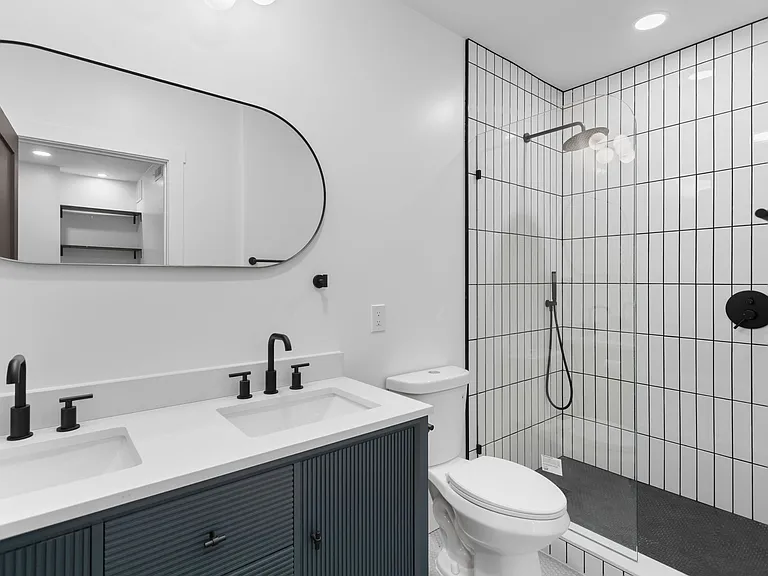 Luxury primary bath _ navy double vanity with dual black matte faucets