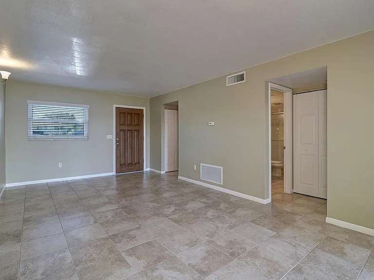 Stone tile floors throughout the apartment