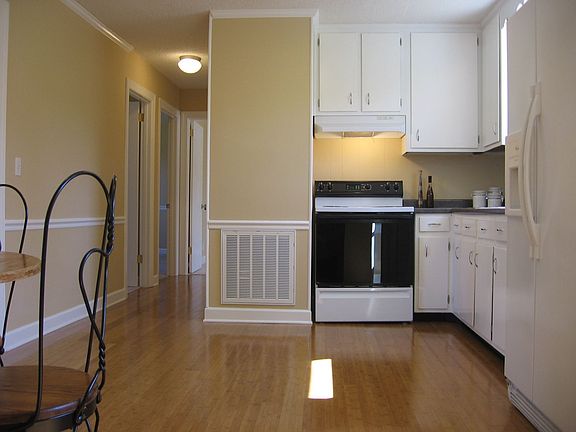 Gleaming bamboo hardwood floors in kitchen, living room and hall