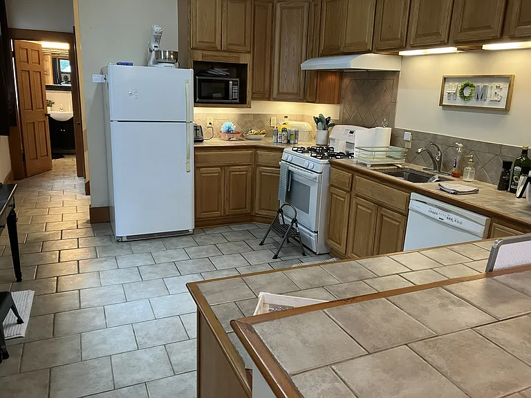 Kitchen has lots of tile counter space.